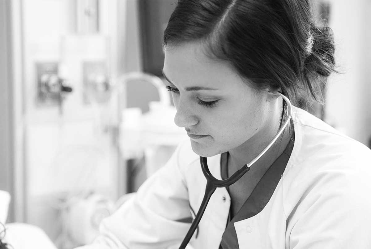 Nursing Program Black and white photo of student gaining experience