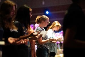 Campus Ministries - students praying in chapel